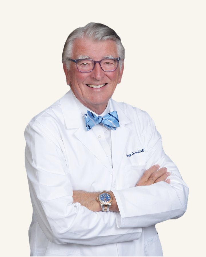 George W. Carroll, MD, in his white coat